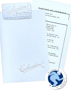 Light blue menu and business card with silver embossed logo. Boulangerie sticker of boule player printed in light and dark blue.