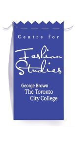 “Fashion Studies” in large flowing script, “George Brown The Toronto City College”, in white stitching on a purple satin garment tag.