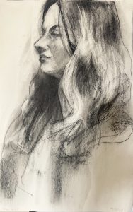 Sideview of woman with long hair, black on white paper.